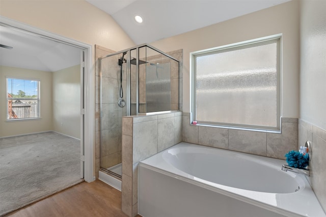 323 Jewett Meadow Dr, Magnolia, TX 77354 - bathroom with a bath, a stall shower, wood finished floors, lofted ceiling, and recessed lighting