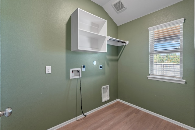 323 Jewett Meadow Dr, Magnolia, TX 77354 - washroom featuring electric dryer hookup, light wood finished floors, washer hookup, baseboards, and hookup for a gas dryer