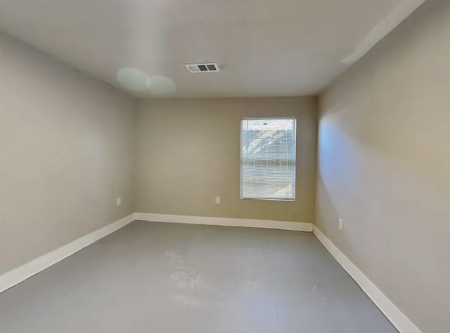 7318 Thurow St, Houston, TX 77087 - spare room featuring concrete floors and baseboards