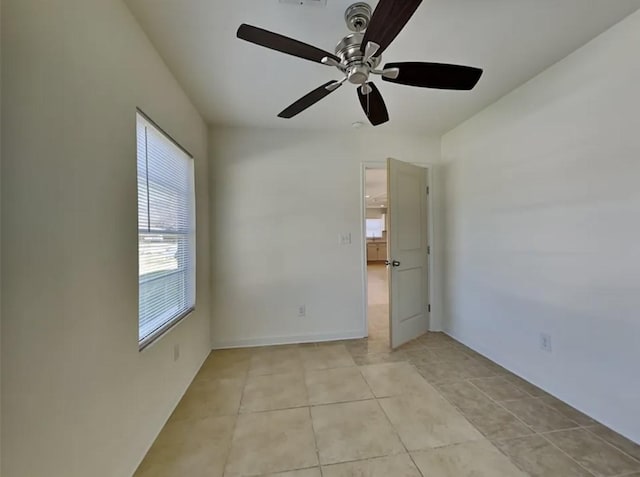 7318 Thurow St, Houston, TX 77087 - empty room with ceiling fan and light tile patterned floors