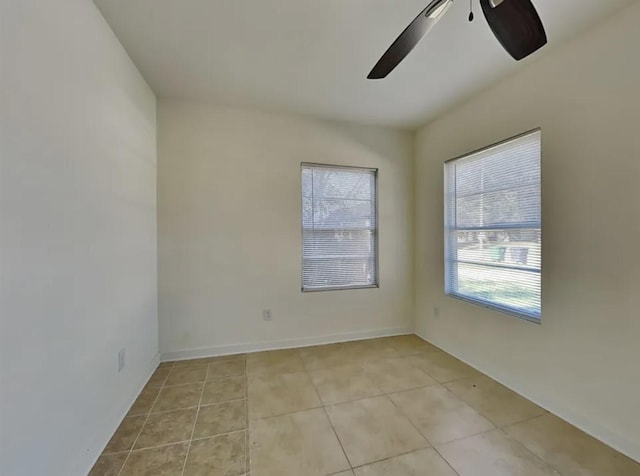 7318 Thurow St, Houston, TX 77087 - spare room featuring light tile patterned flooring and a ceiling fan