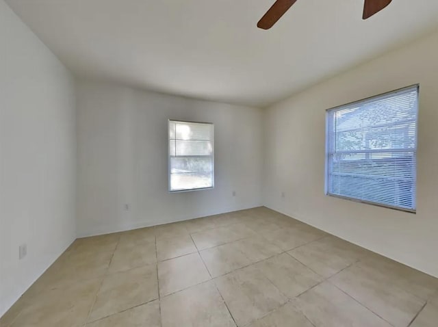 7318 Thurow St, Houston, TX 77087 - spare room with a ceiling fan, plenty of natural light, and light tile patterned floors