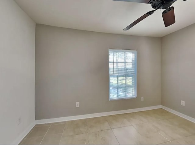 7318 Thurow St, Houston, TX 77087 - empty room featuring ceiling fan, light tile patterned flooring, and baseboards
