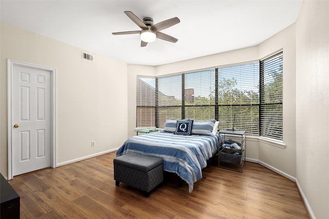 5200 Weslayan St Unit 309, Houston, TX 77005 - bedroom with wood finished floors and baseboards