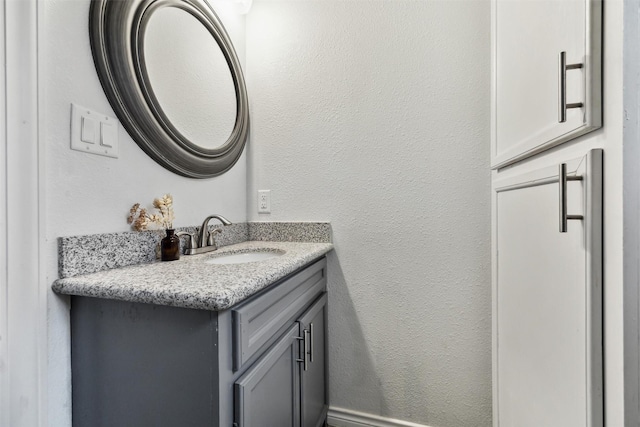 908 Kelley St, Houston, TX 77009 - bathroom with vanity and a textured wall