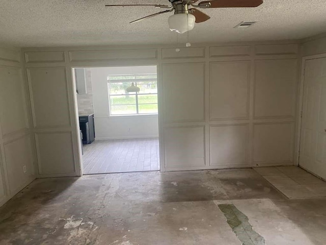 30714 Meadow Wood Dr, Magnolia, TX 77354 - garage featuring a decorative wall and ceiling fan