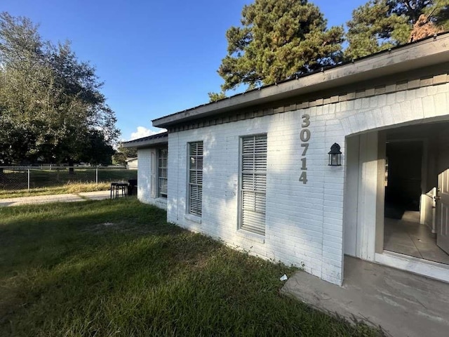 30714 Meadow Wood Dr, Magnolia, TX 77354 - view of home's exterior featuring brick siding
