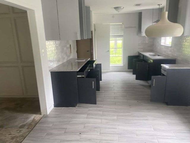 30714 Meadow Wood Dr, Magnolia, TX 77354 - kitchen with tasteful backsplash, light countertops, and wood finish floors