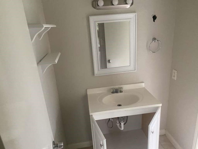 30714 Meadow Wood Dr, Magnolia, TX 77354 - bathroom with vanity and baseboards