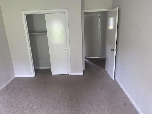 30714 Meadow Wood Dr, Magnolia, TX 77354 - unfurnished bedroom with carpet floors, a closet, and baseboards