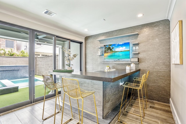 5420 Mcculloch Cir, Houston, TX 77056 - indoor dry bar featuring wood finished floors, baseboards, and recessed lighting