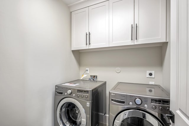 5420 Mcculloch Cir, Houston, TX 77056 - laundry room featuring cabinet space and washer and clothes dryer