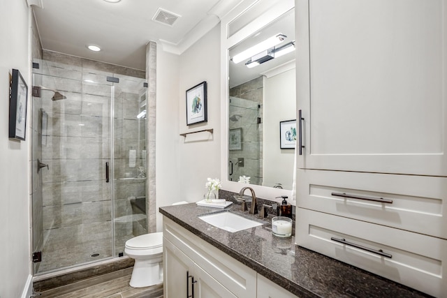 5420 Mcculloch Cir, Houston, TX 77056 - bathroom with vanity, toilet, wood finished floors, and a shower stall