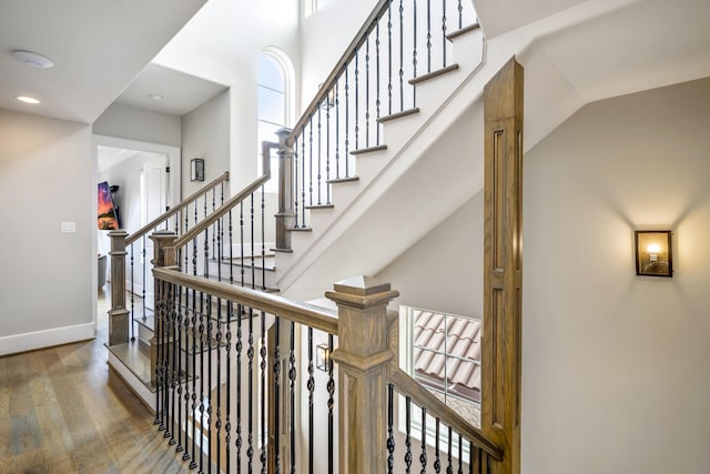 5420 Mcculloch Cir, Houston, TX 77056 - stairs featuring wood finished floors, baseboards, and recessed lighting