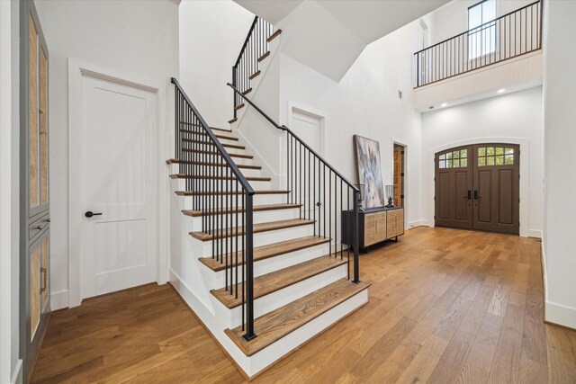 1314 Richelieu Ln, Houston, TX 77018 - foyer featuring stairway, a high ceiling, wood finished floors, and baseboards