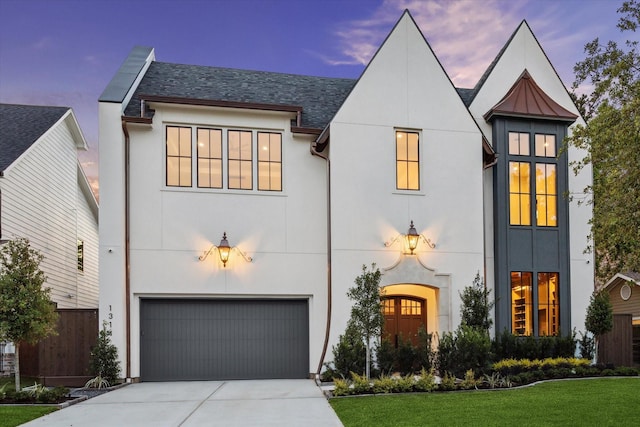1314 Richelieu Ln, Houston, TX 77018 - view of front of house with a garage, driveway, stucco siding, and a front yard