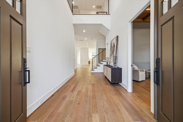 1314 Richelieu Ln, Houston, TX 77018 - entryway featuring a high ceiling, light wood-style floors, baseboards, stairway, and recessed lighting