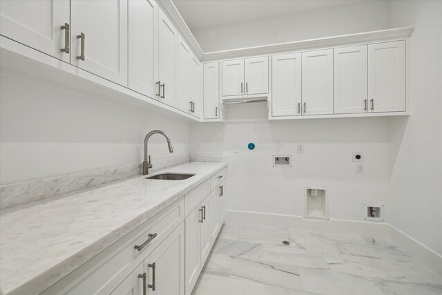 1314 Richelieu Ln, Houston, TX 77018 - laundry area featuring cabinet space, hookup for a gas dryer, hookup for an electric dryer, hookup for a washing machine, and light marble finish flooring