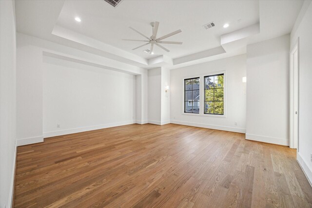 1314 Richelieu Ln, Houston, TX 77018 - spare room with a raised ceiling, ceiling fan, light wood-type flooring, baseboards, and recessed lighting