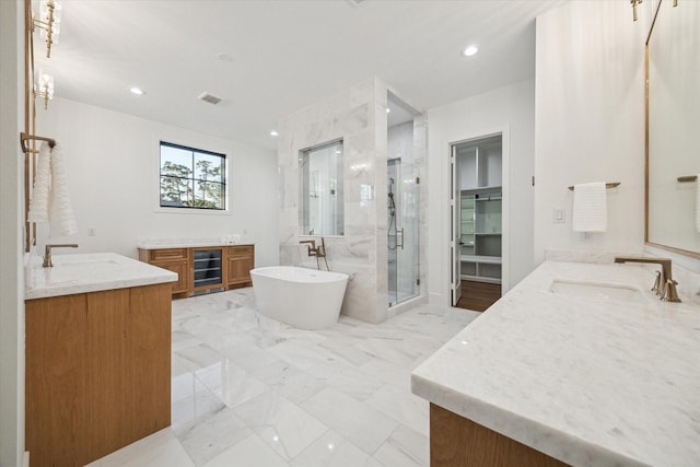 1314 Richelieu Ln, Houston, TX 77018 - full bathroom featuring two vanities, a stall shower, a freestanding tub, beverage cooler, and recessed lighting