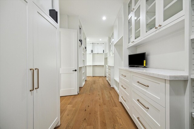 1314 Richelieu Ln, Houston, TX 77018 - walk in closet with light wood-style floors