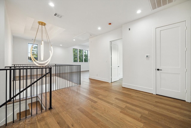 1314 Richelieu Ln, Houston, TX 77018 - hallway with attic access, wood finished floors, baseboards, an upstairs landing, and recessed lighting
