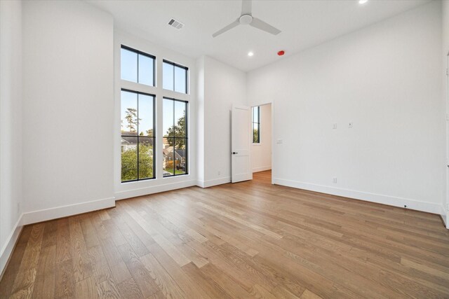 1314 Richelieu Ln, Houston, TX 77018 - spare room featuring healthy amount of natural light, a ceiling fan, recessed lighting, baseboards, and a towering ceiling