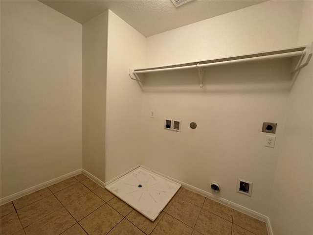914 Paradise Rd, Baytown, TX 77521 - laundry area with electric dryer hookup, hookup for a washing machine, hookup for a gas dryer, and baseboards