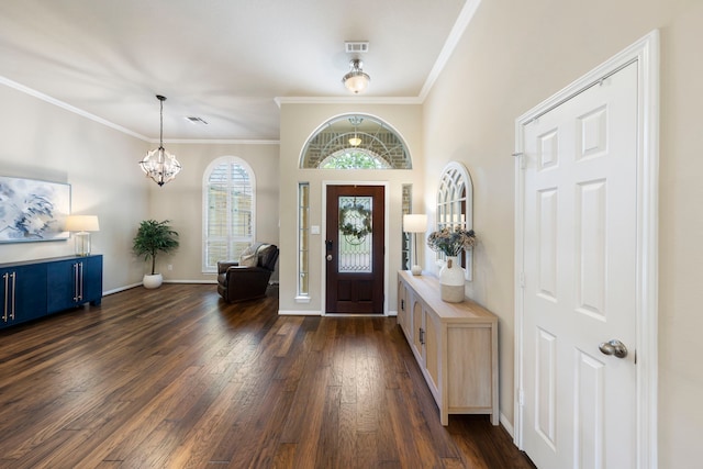 813 Woodland Ct, Conroe, TX 77302 - foyer entrance with dark wood-type flooring, a chandelier, ornamental molding, and baseboards