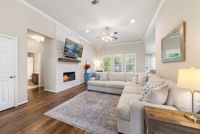 813 Woodland Ct, Conroe, TX 77302 - living area featuring ornamental molding, a ceiling fan, dark wood-type flooring, a stone fireplace, and baseboards
