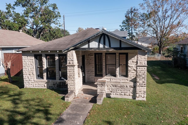 1118 Tulane St, Houston, TX 77008 - view of front facade with a porch, a front yard, and stone siding