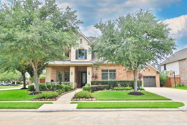9303 Georgetown Glen Cir, Cypress, TX 77433 - view of front of property featuring driveway, brick siding, a garage, and a standing seam roof