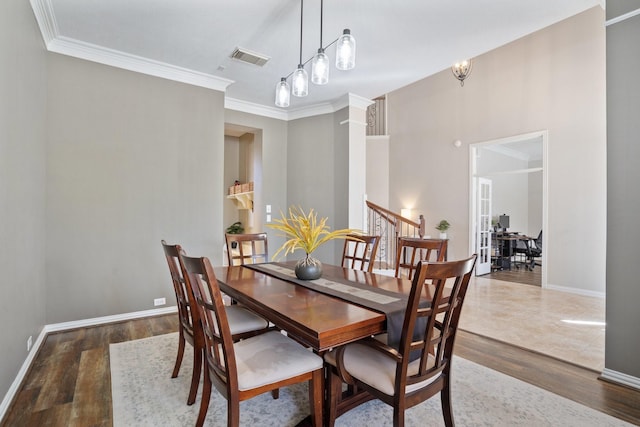 18430 S Settlers Shore Dr, Cypress, TX 77433 - dining space with wood finished floors, baseboards, and crown molding