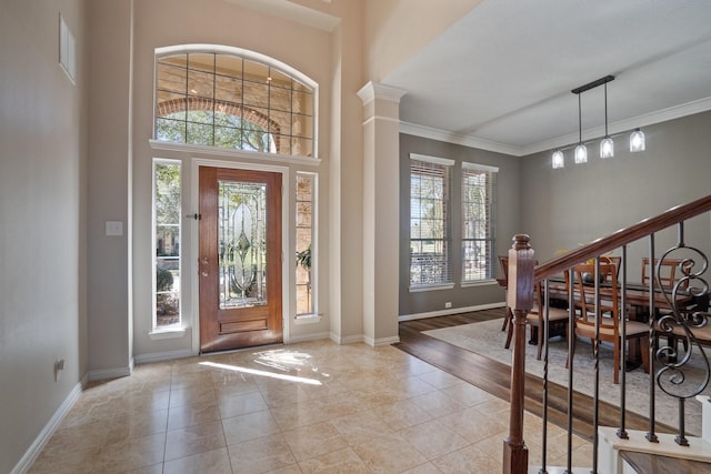 18430 S Settlers Shore Dr, Cypress, TX 77433 - foyer with crown molding, baseboards, tile patterned floors, and stairway