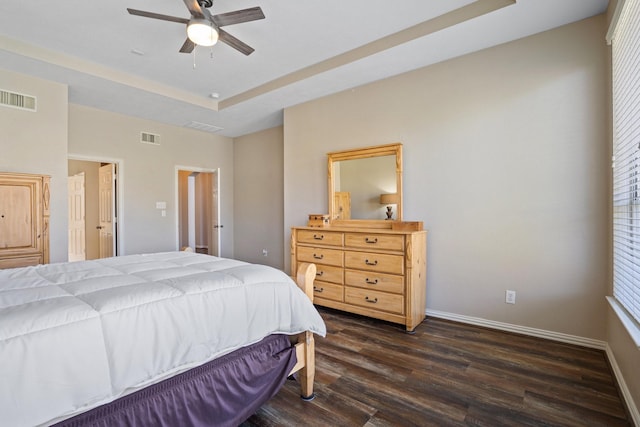 18430 S Settlers Shore Dr, Cypress, TX 77433 - bedroom featuring dark wood finished floors, a raised ceiling, ceiling fan, and baseboards