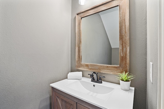 18430 S Settlers Shore Dr, Cypress, TX 77433 - bathroom with a textured wall and vanity