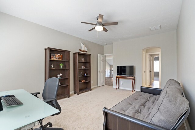 18430 S Settlers Shore Dr, Cypress, TX 77433 - office space featuring a ceiling fan, arched walkways, light colored carpet, and baseboards