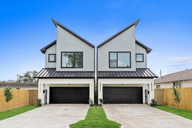 503 Nimrod St, Houston, TX 77020 - view of front of property with a standing seam roof, concrete driveway, board and batten siding, and a garage