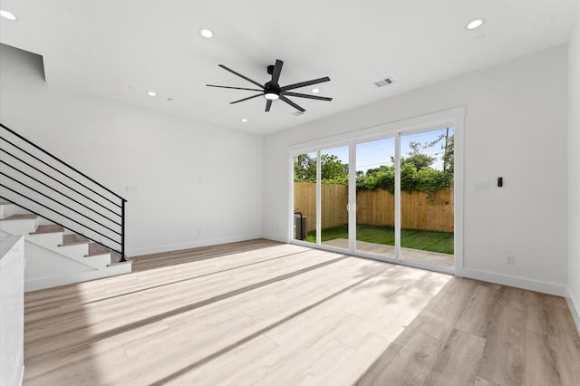 503 Nimrod St, Houston, TX 77020 - unfurnished living room featuring a ceiling fan, wood finished floors, recessed lighting, baseboards, and stairway