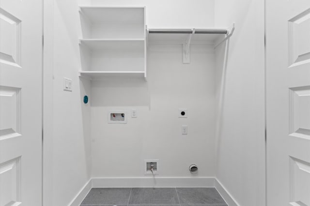 503 Nimrod St, Houston, TX 77020 - laundry room with electric dryer hookup, washer hookup, hookup for a gas dryer, dark tile patterned flooring, and baseboards