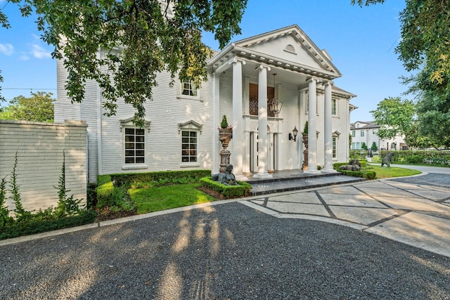 1561 Kirby Dr, Houston, TX 77019 - neoclassical home featuring uncovered parking