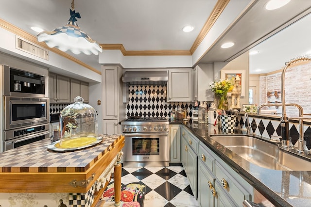1561 Kirby Dr, Houston, TX 77019 - kitchen with stainless steel appliances, wall chimney range hood, ornamental molding, decorative backsplash, and butcher block counters
