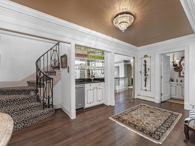 1561 Kirby Dr, Houston, TX 77019 - entryway with a chandelier, stairs, dark wood-type flooring, and ornamental molding
