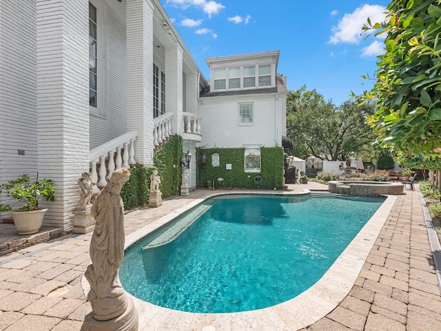 1561 Kirby Dr, Houston, TX 77019 - view of pool featuring a pool with connected hot tub and a patio area
