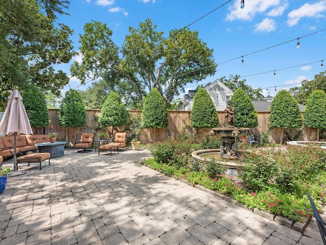 1561 Kirby Dr, Houston, TX 77019 - fenced backyard with a patio area and outdoor lounge area