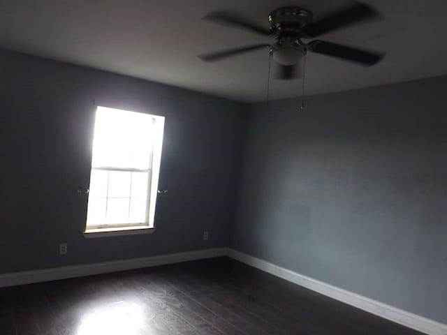 8282 Park Place Blvd Unit G2, Houston, TX 77017 - spare room featuring a ceiling fan, dark wood-style floors, and baseboards