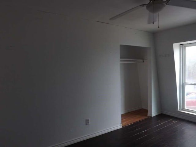 8282 Park Place Blvd Unit G2, Houston, TX 77017 - unfurnished bedroom with wood finished floors, a closet, baseboards, and ceiling fan
