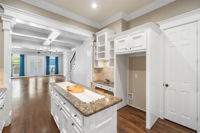 1332 W 25th St Unit A, Houston, TX 77008 - kitchen with ornate columns, white cabinetry, stone counters, a kitchen island, and open floor plan