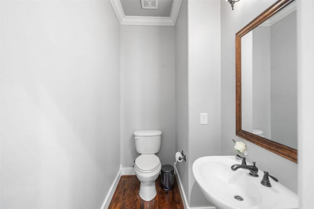 1332 W 25th St Unit A, Houston, TX 77008 - half bath with toilet, a sink, wood finished floors, baseboards, and crown molding