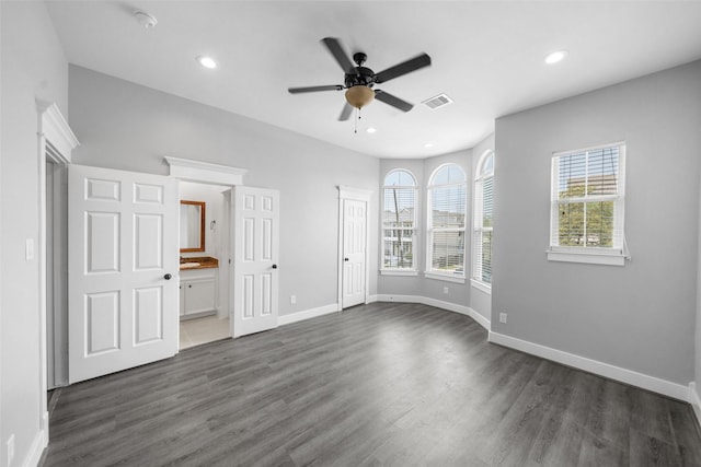 1332 W 25th St Unit A, Houston, TX 77008 - unfurnished bedroom with dark wood-style flooring, baseboards, recessed lighting, ensuite bathroom, and a ceiling fan